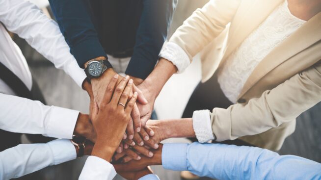 Hands stacked on top of each other indicating unity