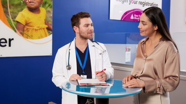 Blood donor reviewing eligibility with a CTBC doctor.